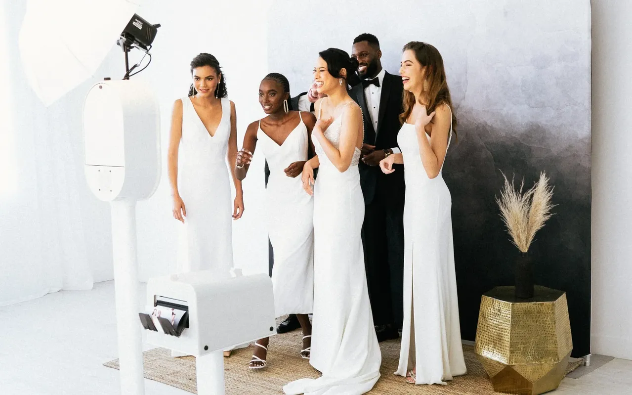 Wedding party enjoying an open-air photo booth